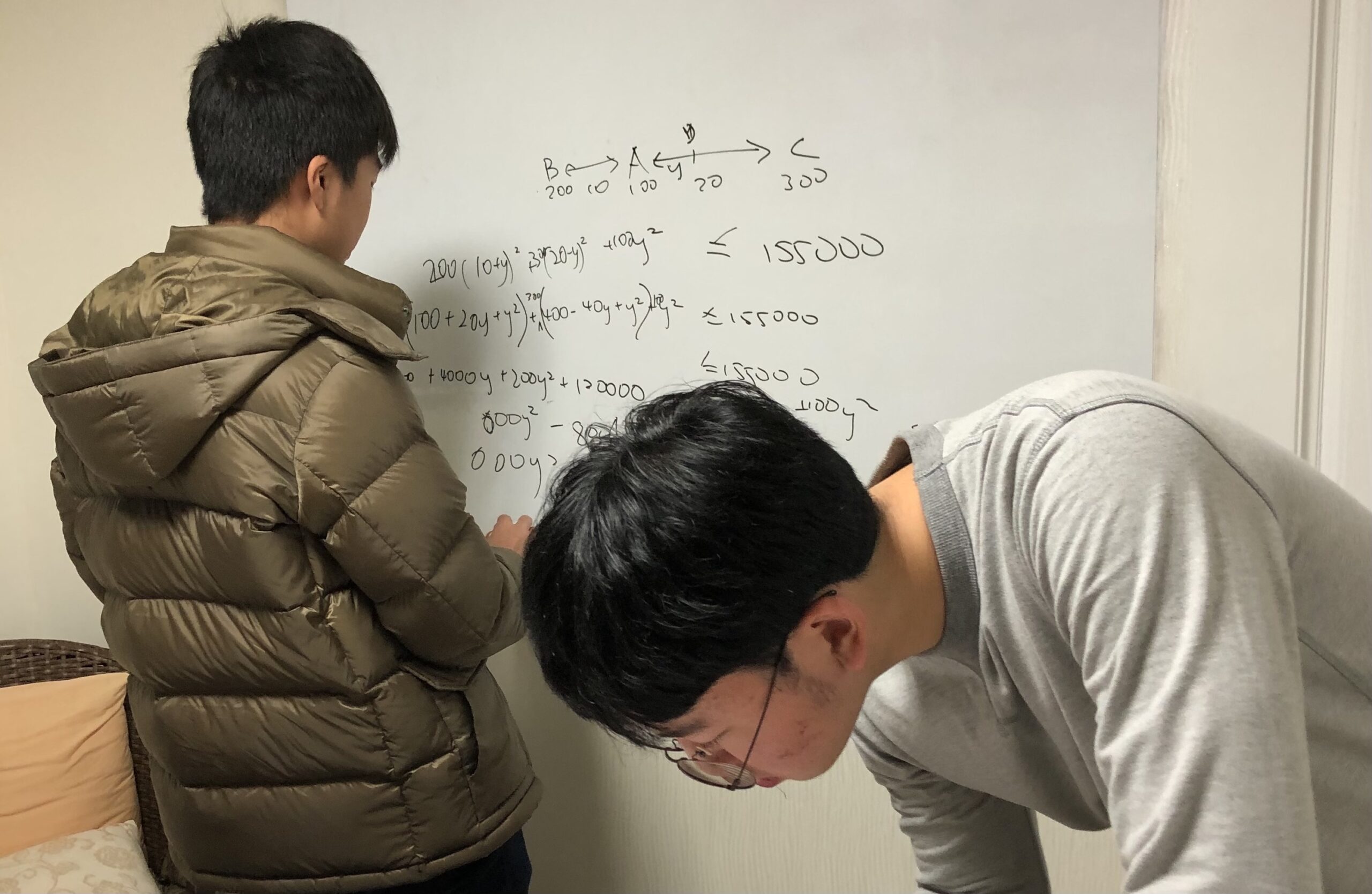 2 Boys solving math question